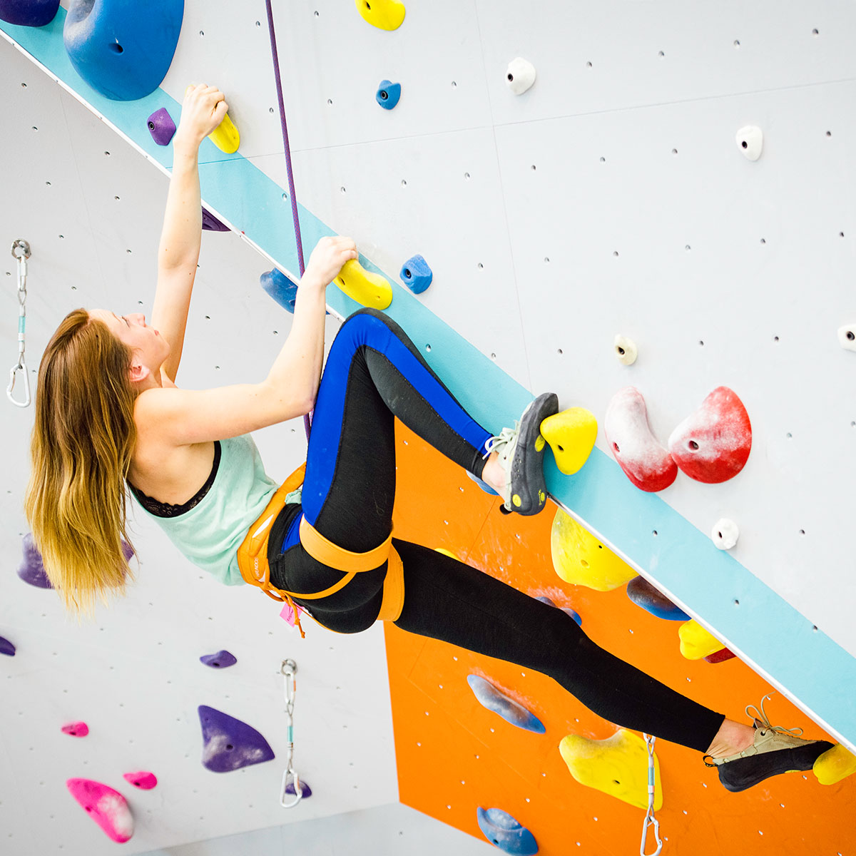 woman teaching climbers