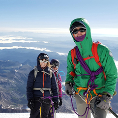 man and 2 woman summiting Mt Rainier