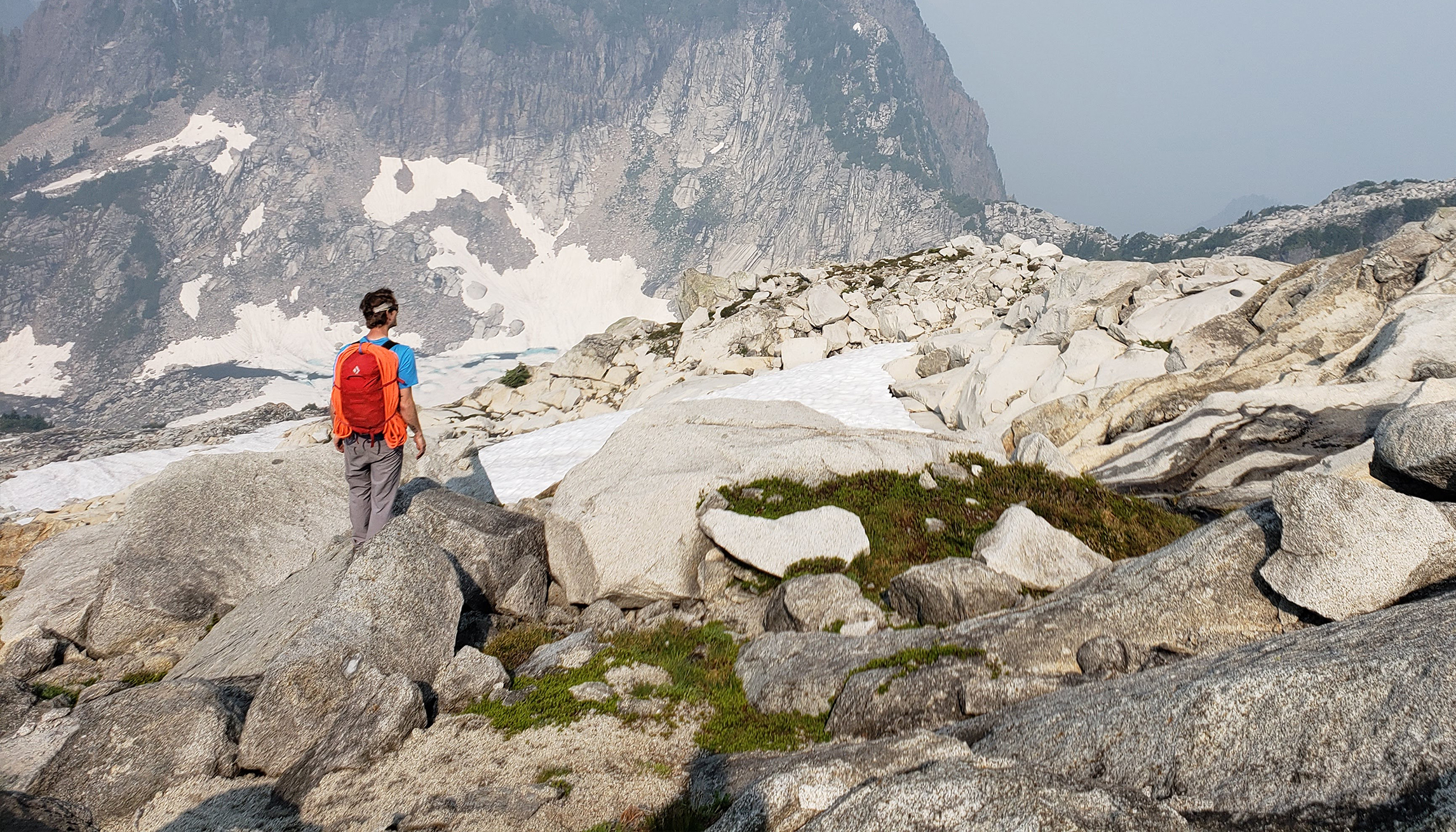 climber standing in Alpine meadow